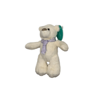 Charlie Bear with a purple ribbon 