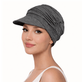 Chemo Cap - stretchy baseball style in grey worn by a woman, perfect for sunny days and stylish outfits.
